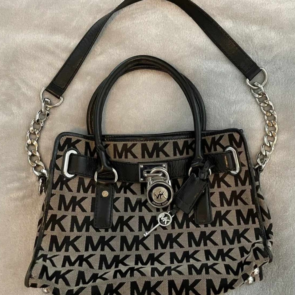 Michael Kor Handbag with Gold Tone locking emblem and key